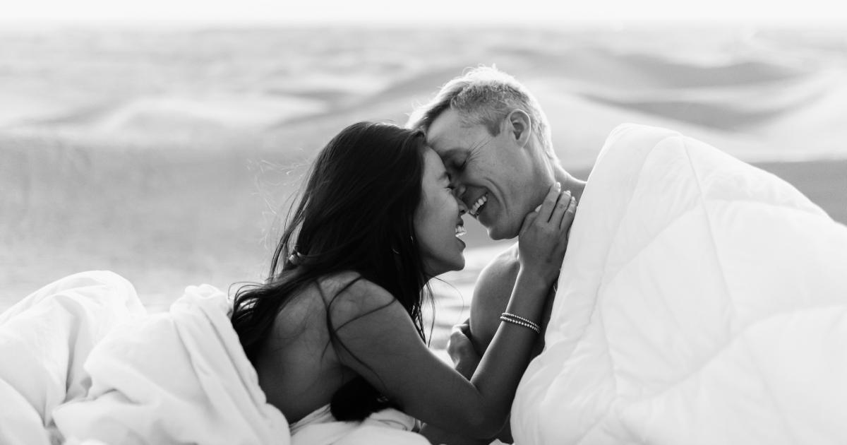 Couple relaxing on comfortable bed