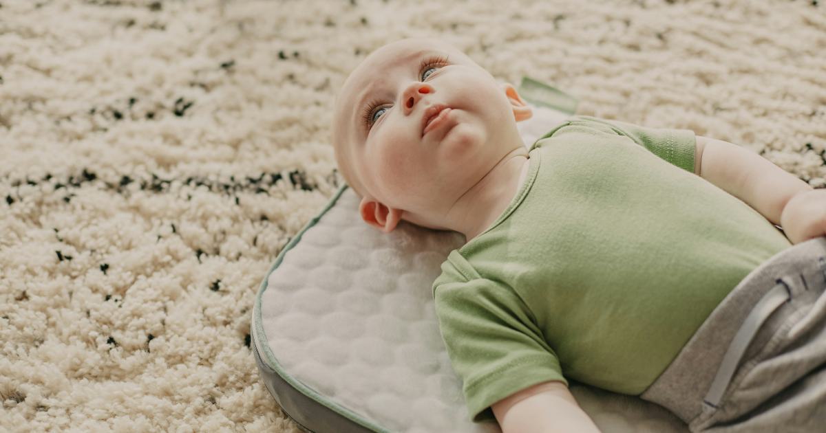 Baby Sleeping on Breathable Mattress Topper