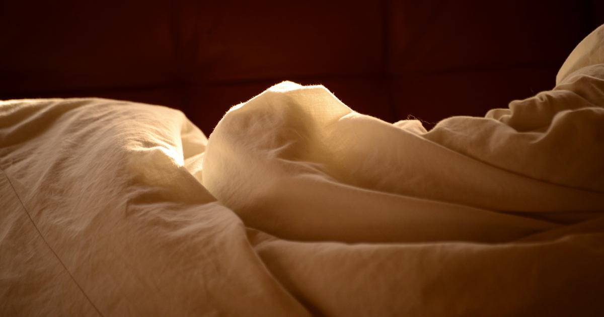 Woman sleeping comfortably on memory foam mattress