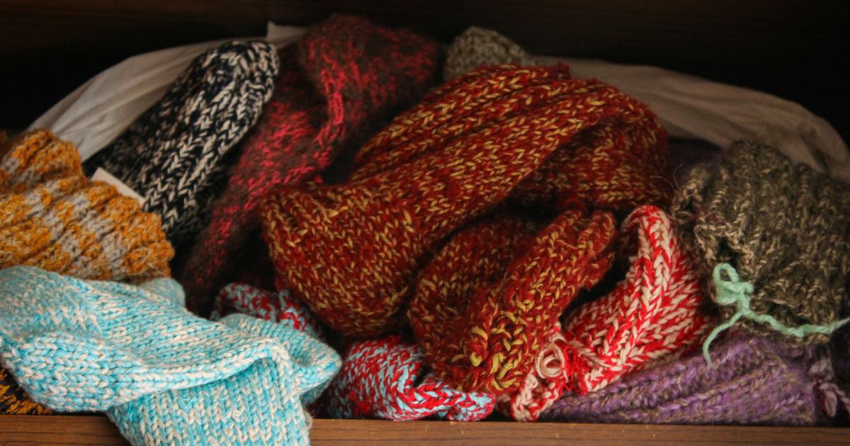 Woman Organizing Storage Under Bed