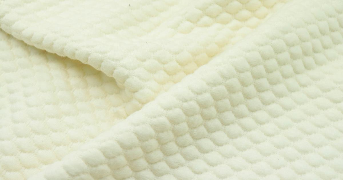 Illustration de la personnalisation de la fermeté d'un matelas à ressorts ensachés
